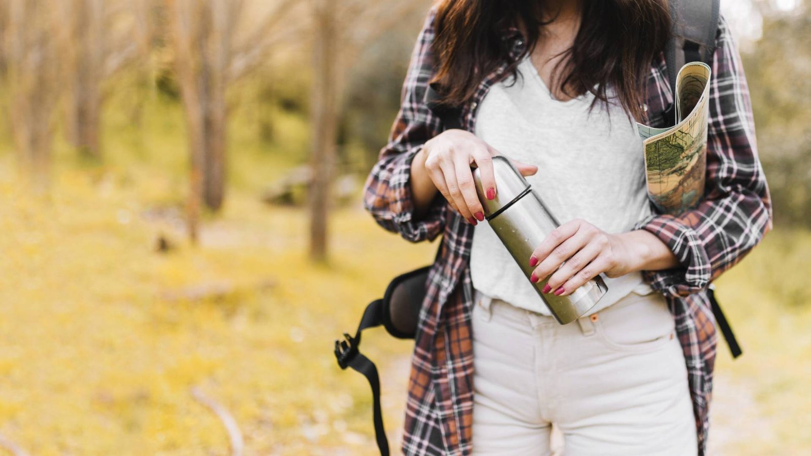 Crop Woman With Map Closing Thermos Scaled